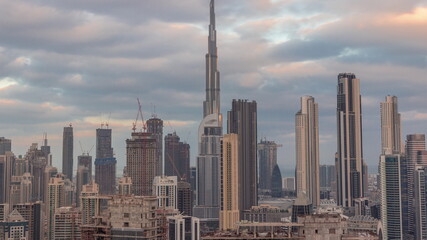 Fototapeta premium Panoramic skyline of Dubai with business bay and downtown district morning timelapse.