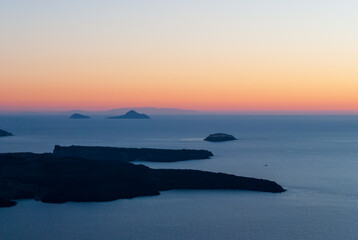 Caldera and Greek islands after sunset