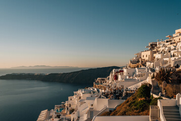 Fototapeta premium The city of Imerovigli, Santorini in the sunset rays