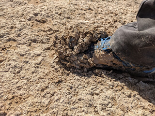 photo of foot step in wet muddy ground