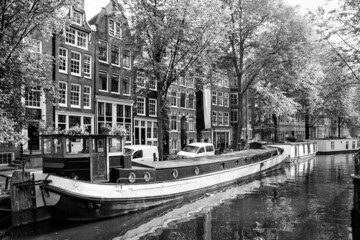 Fototapeta premium Canal in Amsterdam with houseboats