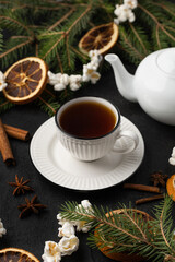 Christmas tea party with christmas tree, dried oranges and popcorn garland