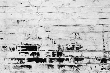 Texture of a brick wall with cracks and scratches which can be used as a background