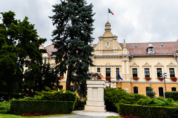 Monument Lupa Capitolina in Tricolor Square with the Brasov Town Hall in the back. Brasov, Romania.