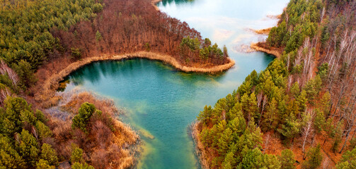 Obraz premium Quarry for mining and enrichment of titanium and other rare ores. Blue water in the enrichment tank.