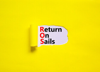 ROS return on sales symbol. Concept words ROS return on sales on white paper. Beautiful yellow background, copy space. Business and ROS return on sales concept.