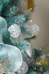 Christmas tree decorated with white lace diy baubles, cones and garlands. Closeup shot. Merry Christmas, Happy New Year