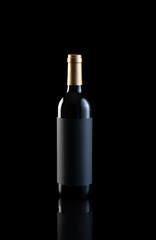 bottle of red wine on black background