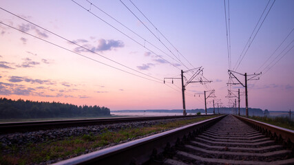 Fototapeta na wymiar Fast traffic on rail flights. Towards sunset.