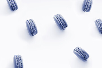 Sweet french desserts of color macaroons or macarons isolated at white background. Color of the year 2022. Main trend concept.
