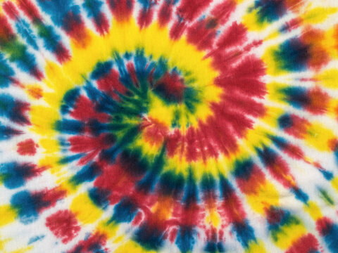 Multi-colored colorful tie dye pattern on fabric. Flat lay. © kvladimirv