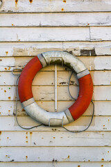 Rescue Buoy on grungy wooden wall