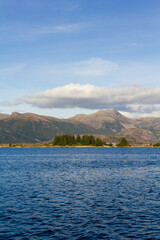 Calm sea with mountains on the background