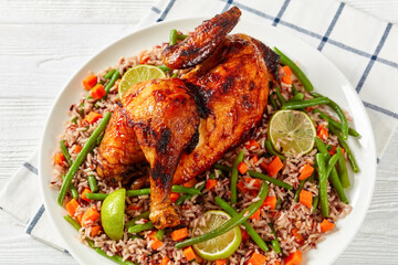 Roasted Half Chicken with brown rice on a platter