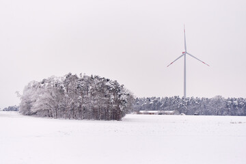 Wind turbine in winter season with snow