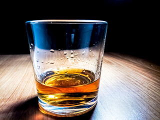 drink with ice on a wooden table