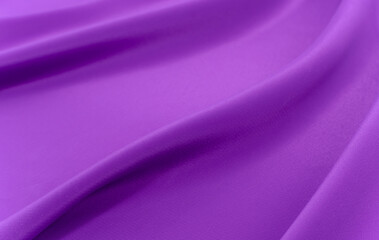 A piece of burgundy, violet, red cloth. Fabric texture for background and design works of art, beautiful wrinkled pattern of silk or linen. A crumpled piece of cloth