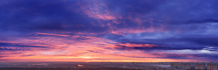 Wonderful summer landscape. Sunset. Bright orange-pink sky at dawn.