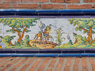 Tiles painted with a  scene of Don Quixote. Adventurous Don Quixote fighting with a sword. Puerto Lápice, province of Ciudad Real, La Mancha, Spain, Europe