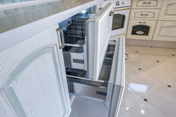 modern and comfortable built-in household appliances, refrigerator built into the kitchen cabinet