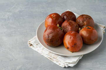 ugly fruits persimmon on grey background ugly food zero waste