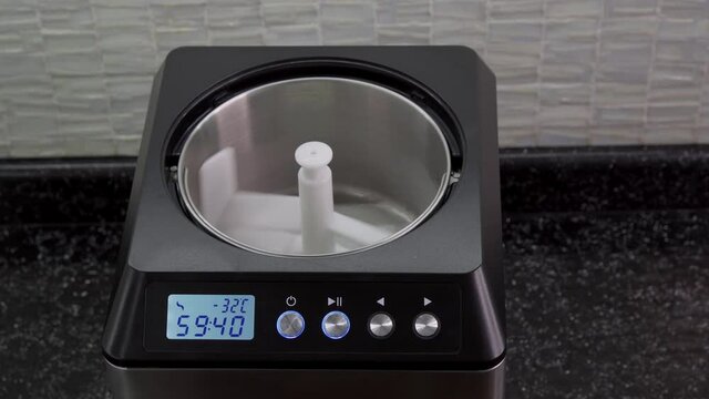 Pour cream into an ice cream maker to make natural ice cream. Ingredients for making ice cream.