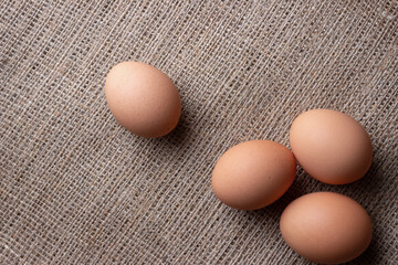 fresh eggs on jute cloth