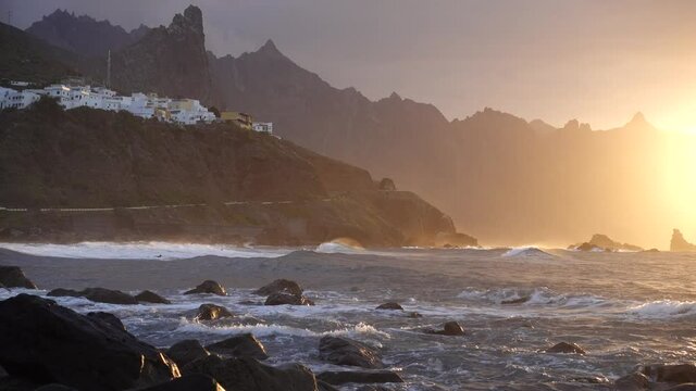Ocean waves crash on rocks in sunset light Playa Benijo beach, Tenerife, Canary