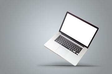 New laptop display with keyboard and blank white screen isolated on a white background.