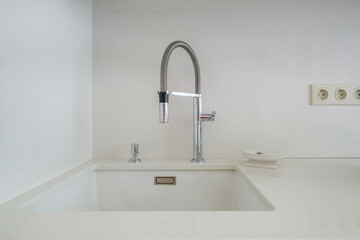 Water tap sink with faucet in expensive kitchen