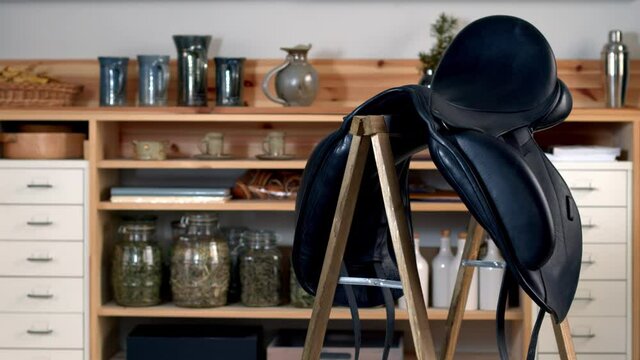 Leather black horse saddle. Professional dressage equestrian equipment object spin.