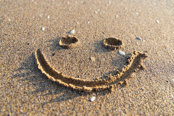 Fototapeta na wymiar A painted smile in the sand.