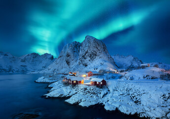 Aurora Borealis, Lofoten islands, Norway. View on the houses in the Hamnoy village, Lofoten Islands, Norway. Iconic view in Norway. High resolution photo. - obrazy, fototapety, plakaty