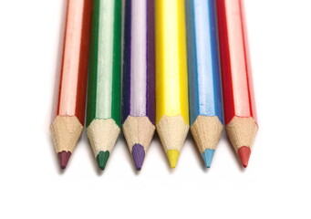 Colorful pencils set arrangement, row isolated on white, top view 