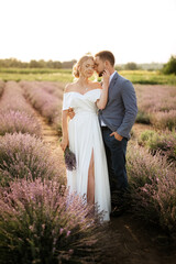 bride and groom on in the lavender field