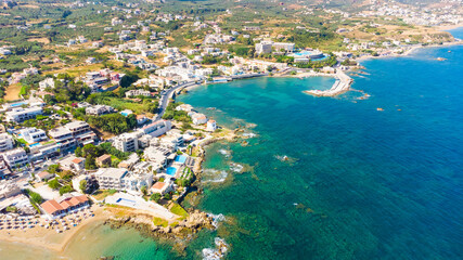 Naklejka premium Aerial view of the beautiful city of Chania with it's old harbor and the famous lighthouse, Crete, Greece.
