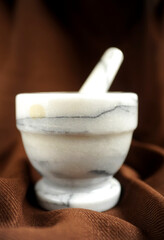 Old marble  mortar close up photo on dark background