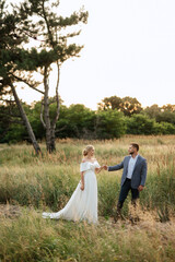 bride and groom on in the woods