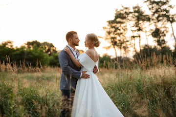 bride and groom on in the woods