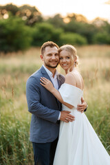 bride and groom on in the woods