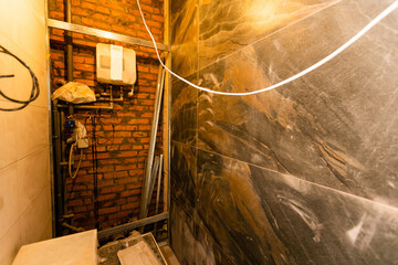 Fototapeta na wymiar bathroom renovation - removing tiles in apartment bathroom