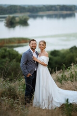 bride and groom on in the woods