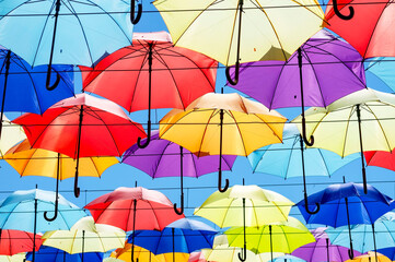Avenue of color umbrellas. a lot of different umbrellas. Summer mood. Concept Good mood, positive.