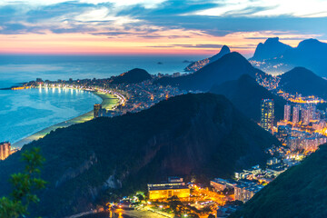 An evening photo of Rio de Janeiro and Copacabana beach, Brazil