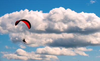 Motorised paraglider over Vancouver Island, Canada.