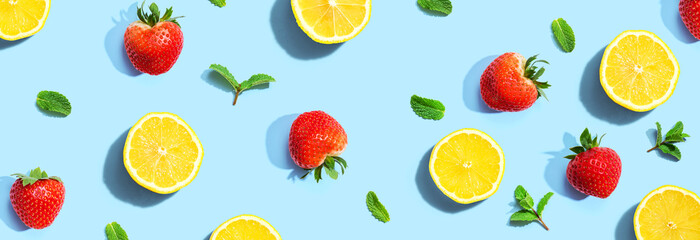 Fresh lemons and strawberries with mints overhead view - flat lay