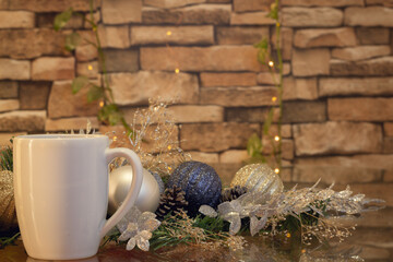 Christmas background ideal for gift cards with spheres and plants and a coffee mug
