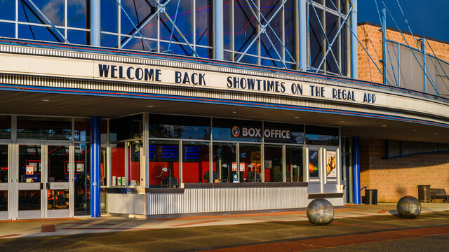 Redmond, WA, USA - May 20, 2021; Regal Movie Theater At The Bella Bottega Shopping Center In Downtown Redmond With A Welcome Back Sign Of Reopening