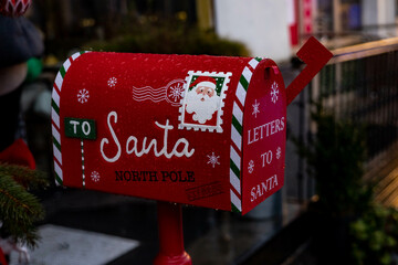 Santa Claus mailbox and gift with bow and ribbons. Gift for Christmas.