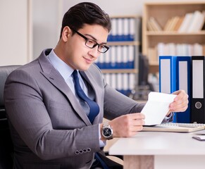 Businessman receiving letter in the office